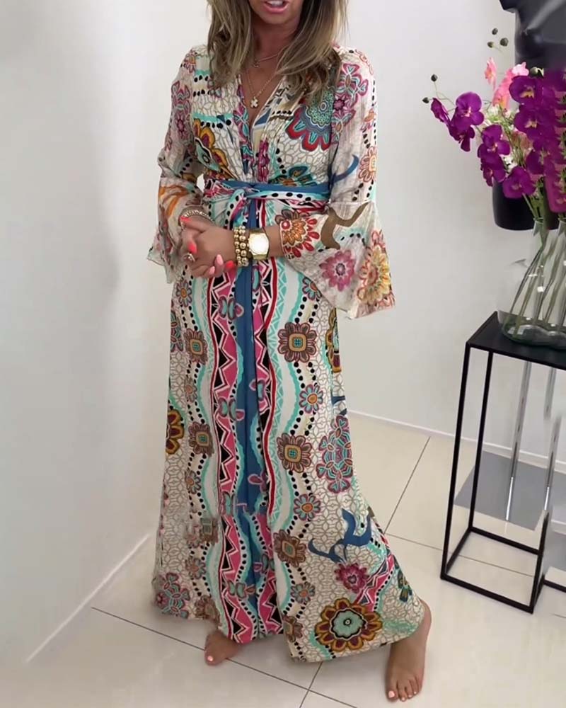 Elegant dress with colorful print and bell sleeves