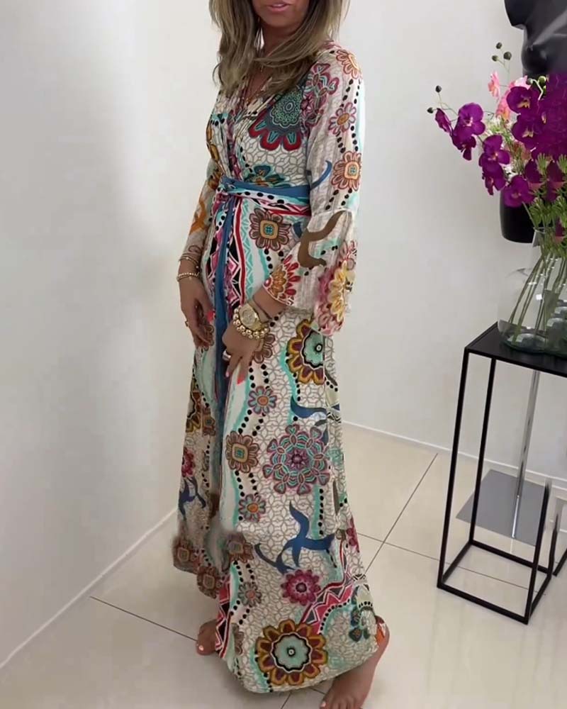 Elegant dress with colorful print and bell sleeves