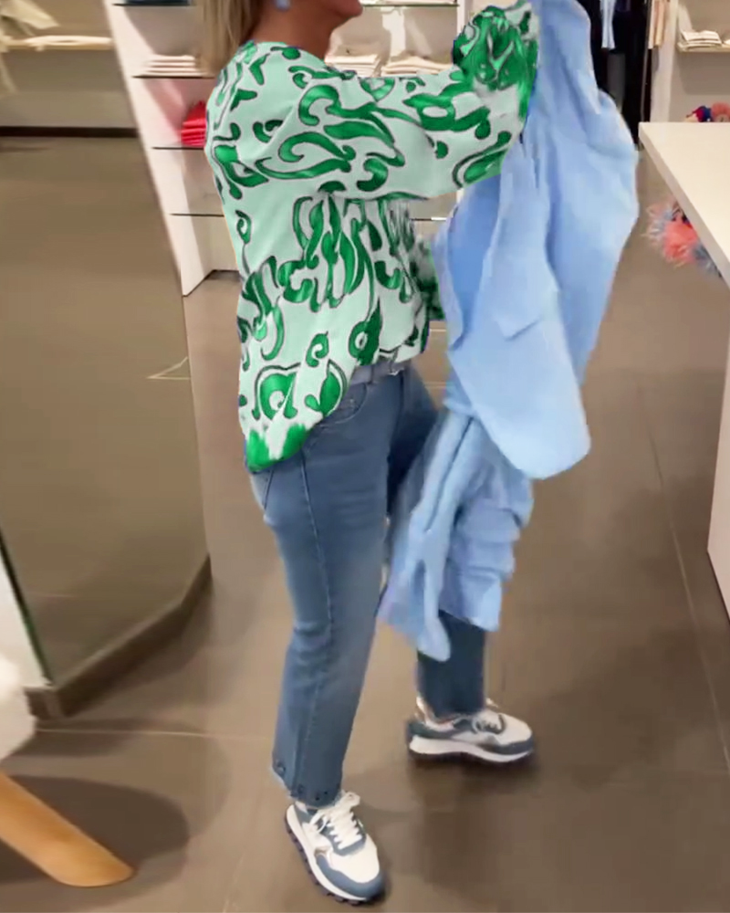 Elegant long-sleeved top with printed V-neck