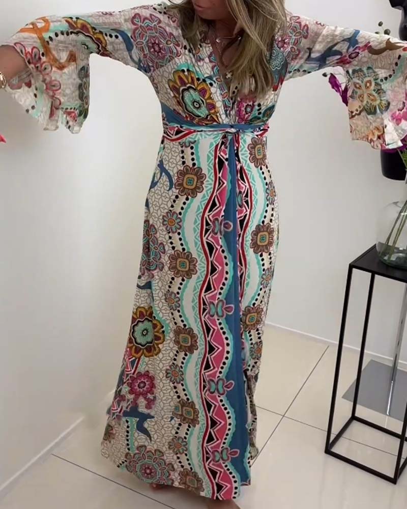 Elegant dress with colorful print and bell sleeves