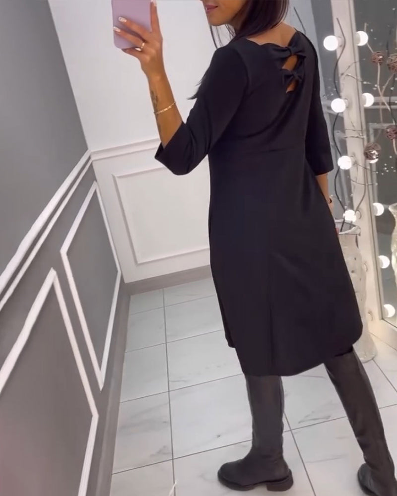 Solid color dress with bow at back