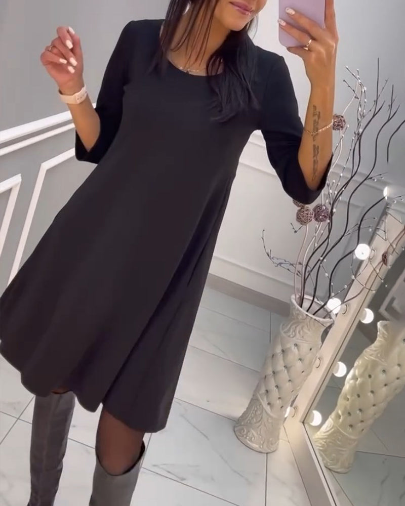 Solid color dress with bow at back